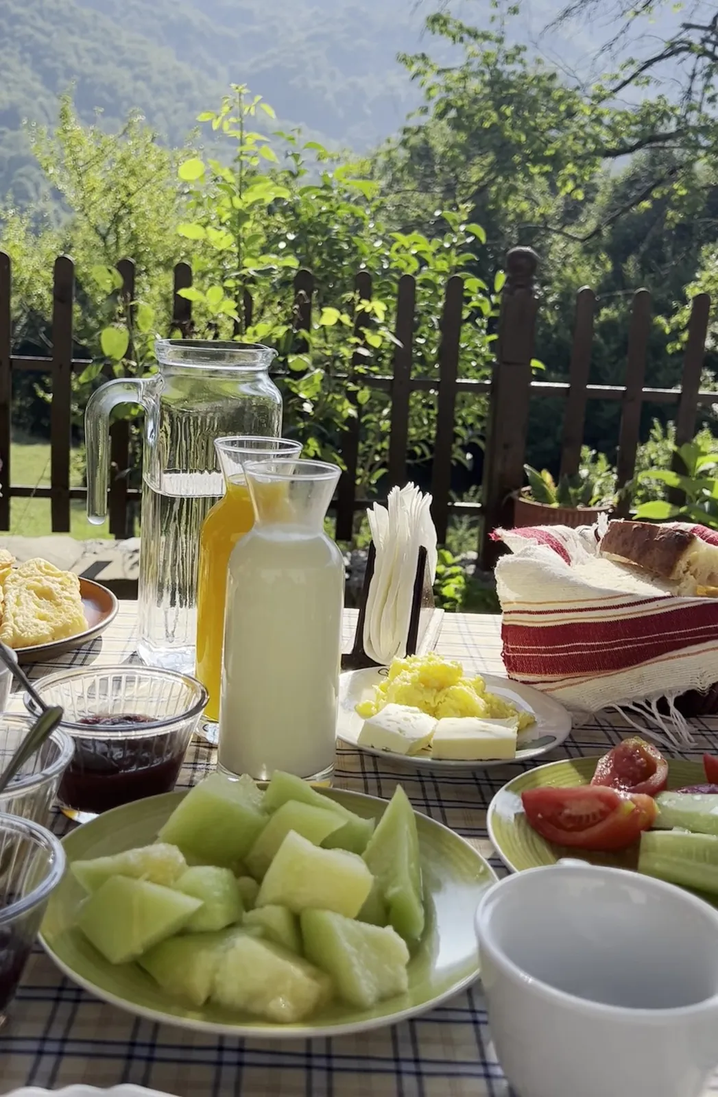 Melon, cheese, jam and bread at breakfast