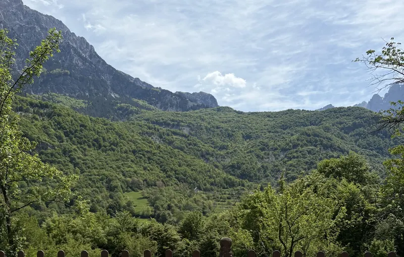 The green valley of Theth and its limestone walls, seen from the guest house