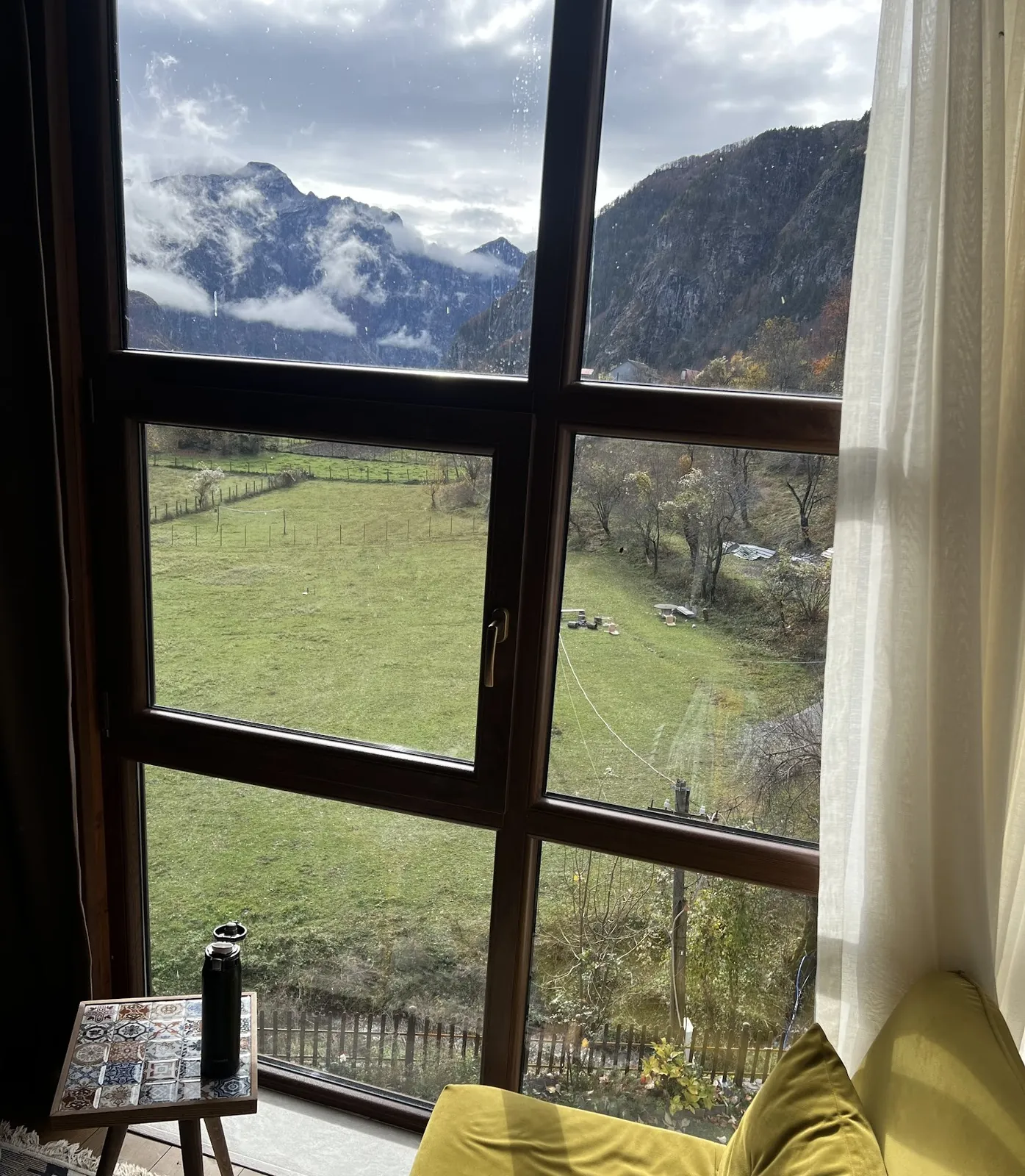 Window over the meadows and peaks